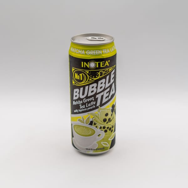 A can of INOTEA Matcha Green Tea Latte Bubble Tea with tapioca pearls on a white background.