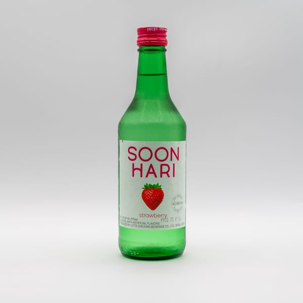 A green bottle of Soon Hari strawberry soju with a red cap on a white background.