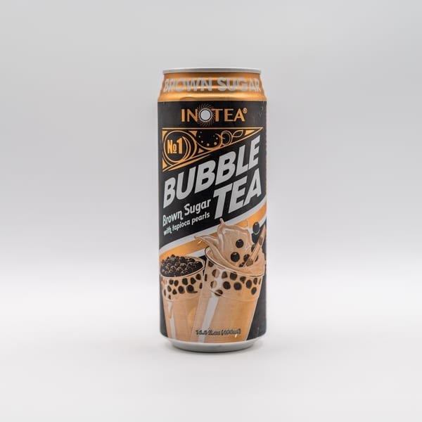 A can of Inotea Brown Sugar Bubble Tea with tapioca pearls, against a white background.